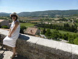 Miaomiao at the La Promenade square, with a view on the countryside to the southwest of the town