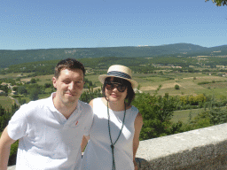 Tim and Miaomiao at the La Promenade square, with a view on the countryside to the northwest of the town