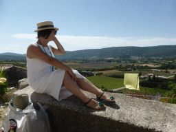 Miaomiao at the Rue Porte Sainte-Anne street, with a view on the countryside to the southwest of the town