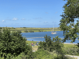 The Brouwersdam and a boat in the Grevelingenmeer lake, viewed from the staircase from the Rampweg road to the West Repart beach