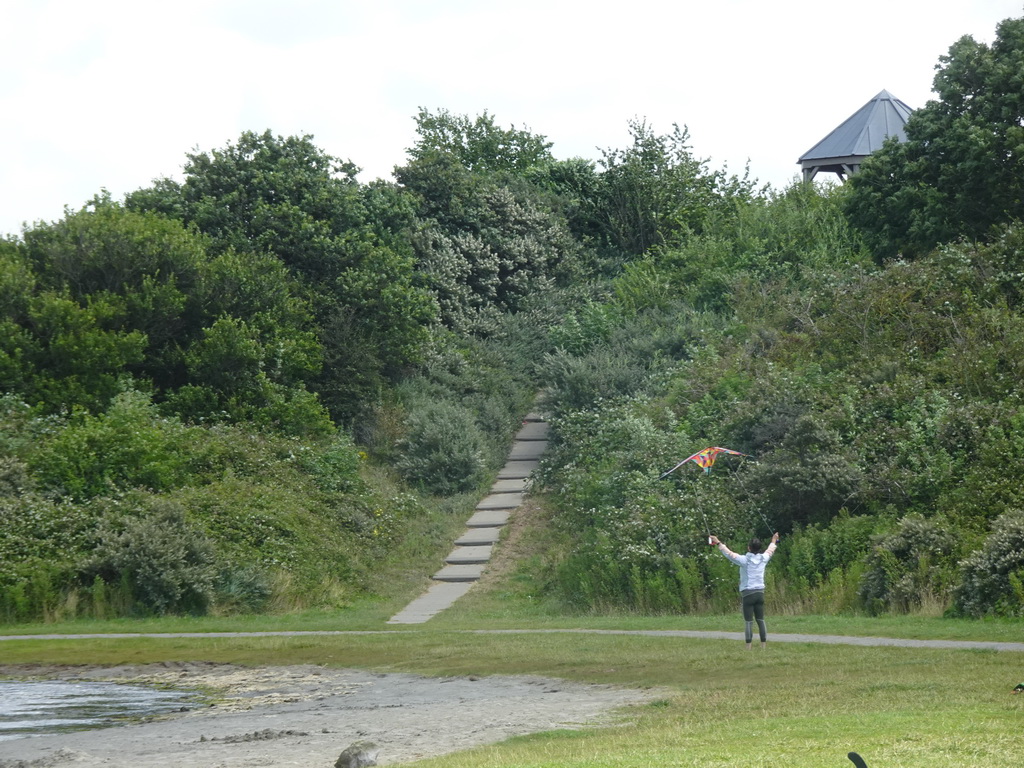 Miaomiao flying a kite at the West Repart beach