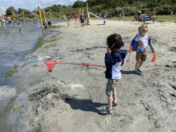 Max and his friend letting crabs go at the West Repart beach