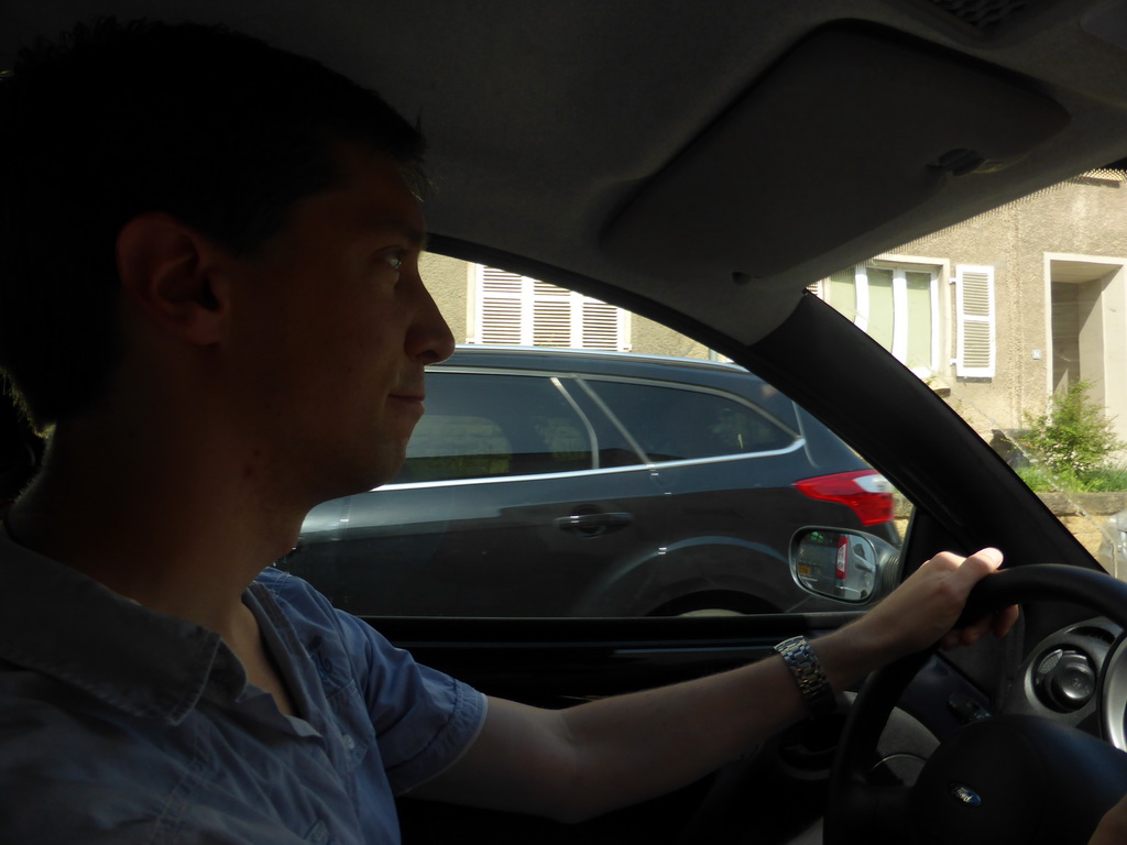 Tim in the car on the Route du Vin road at Schengen