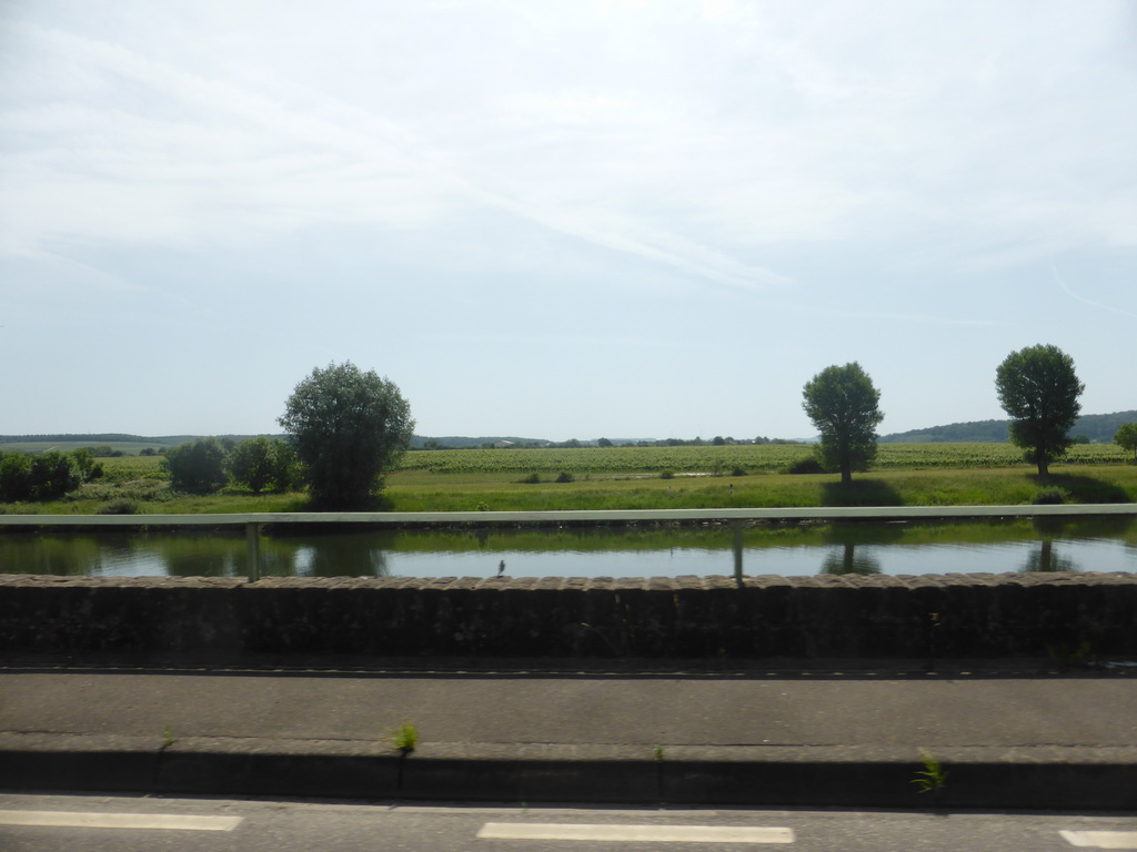 The Moselle river next to the Route du Vin road between Stadtbredimus and Hettermillen, viewed from the car