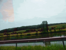 Wine fields and the Moselle river next to the Route du Vin road near Ehnen, viewed from the car