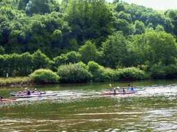 Kanoes in the Moselle river next to the Route du Vin road near Ahn, viewed from the car