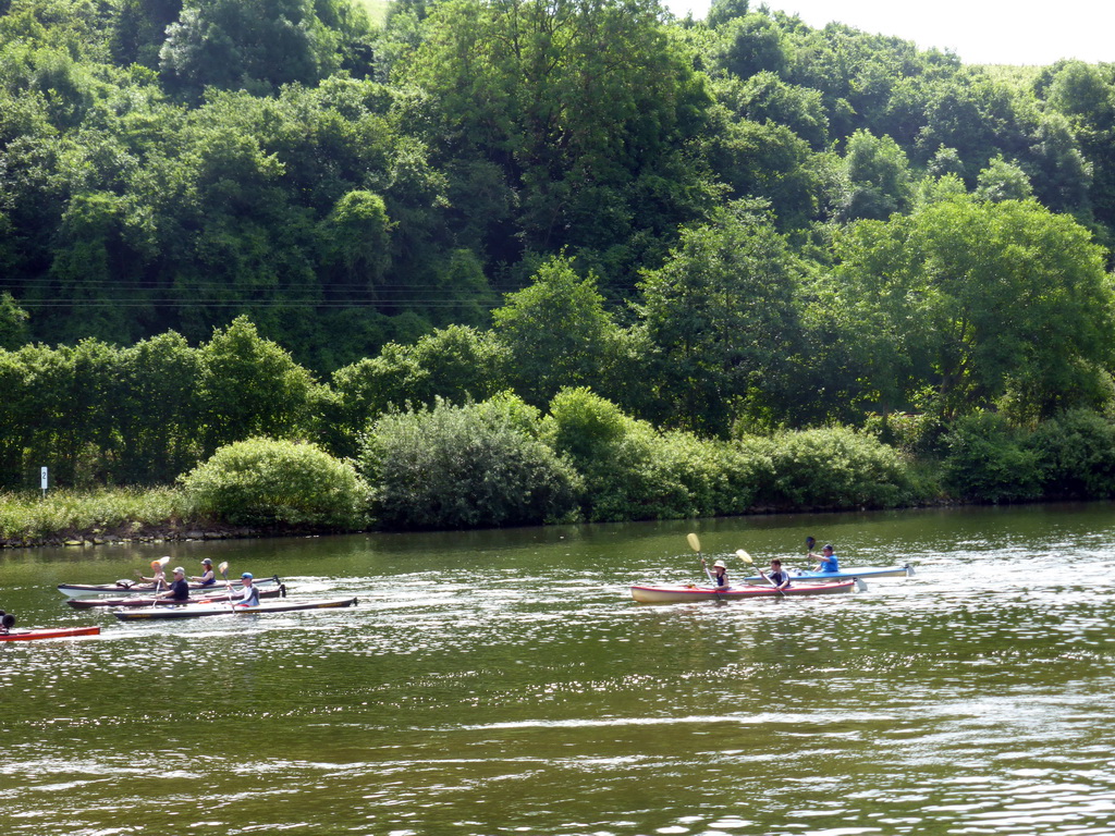 Kanoes in the Moselle river next to the Route du Vin road near Ahn, viewed from the car