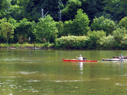 Kanoes in the Moselle river next to the Route du Vin road near Ahn, viewed from the car