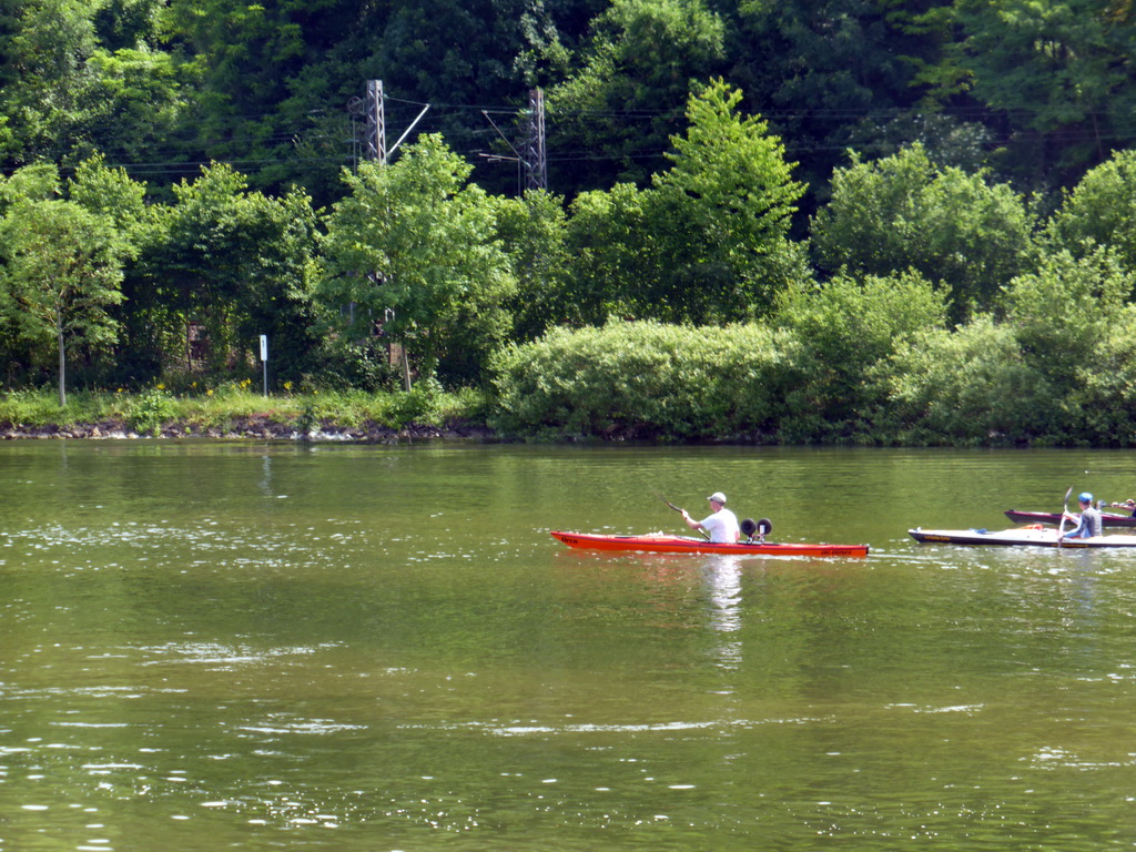 Kanoes in the Moselle river next to the Route du Vin road near Ahn, viewed from the car