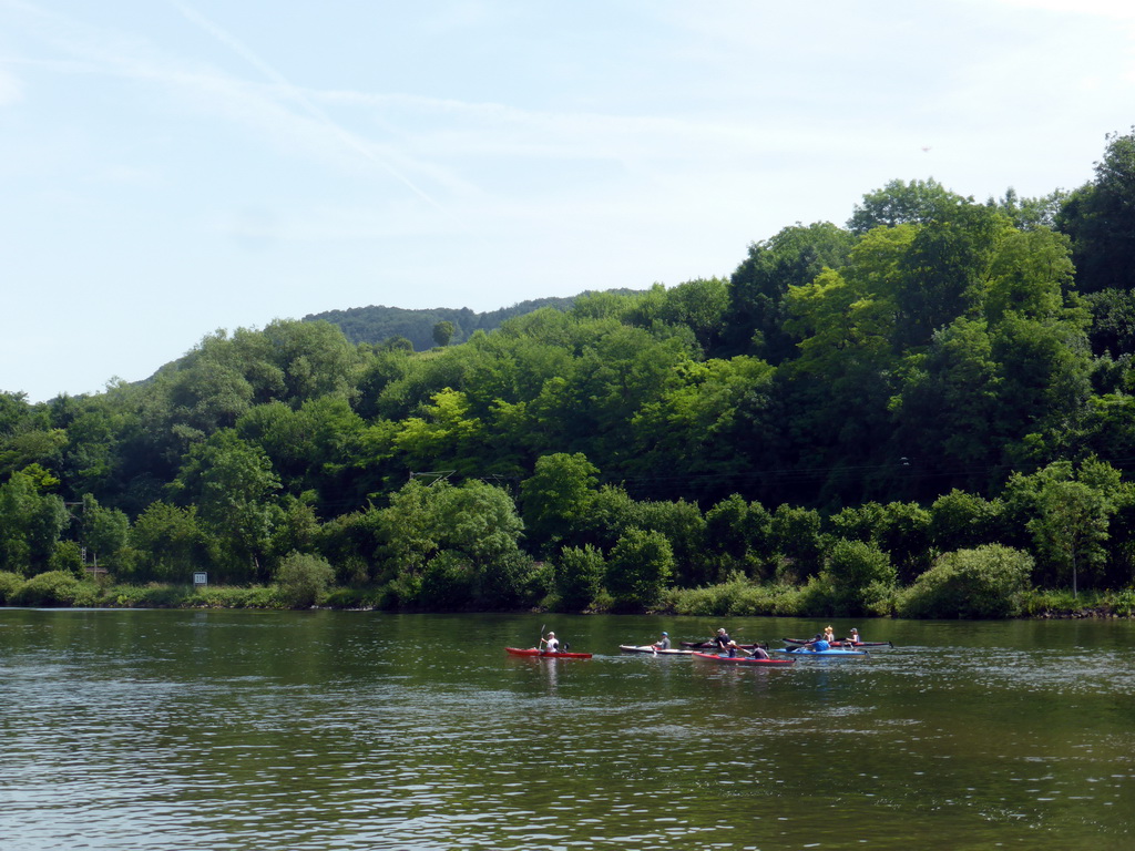 Kanoes in the Moselle river next to the Route du Vin road near Ahn, viewed from the car