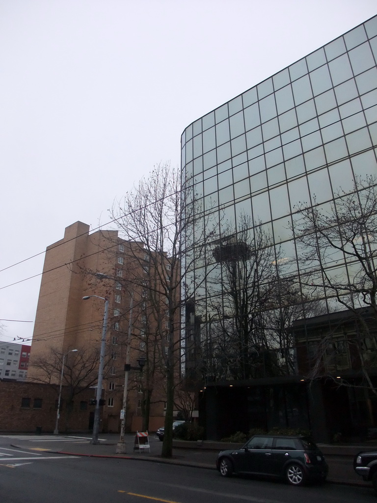 Reflection of the Space Needle in a building at the crossing of Cedar Street and 4th Avenue