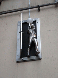 Small statue holding a light bulb at the Pike Place Hillclimb Walk