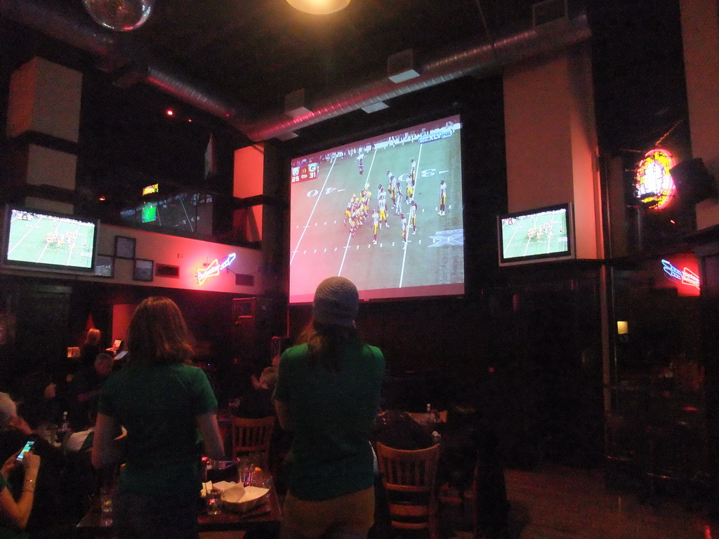 American football fans watching Super Bowl XLV at Jillian`s Billiard Club at 9th Avenue North