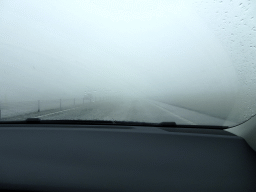 Heavy rain between Hveragerði and Hellisheiðarvirkjun, viewed from the rental car on the Þjóðvegur road