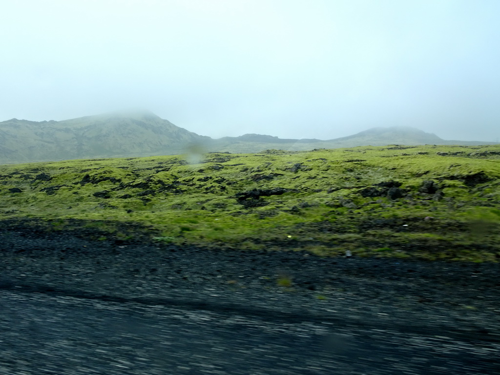 Hills near the Hellisheiði Power Station, viewed from the rental car on the Þjóðvegur road
