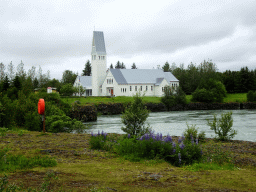 The Selfoss Kirkja church and the Ölfusá river, viewed from the parking place of Hotel Selfoss