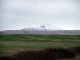 Grassland and mountains at a town near the Seljalandsfoss waterfall