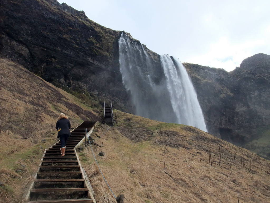 Miaomiao on the northern staircase at the Seljalandsfoss waterfall