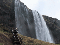 Miaomiao on the northern staircase at the Seljalandsfoss waterfall
