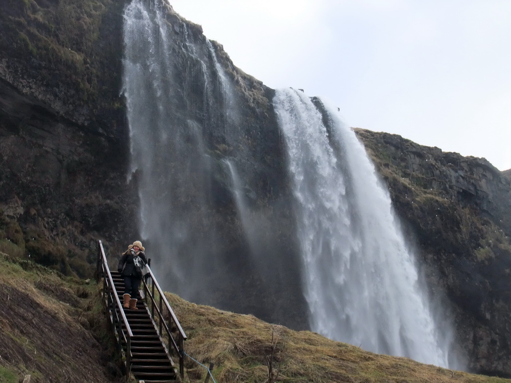 Miaomiao on the northern staircase at the Seljalandsfoss waterfall