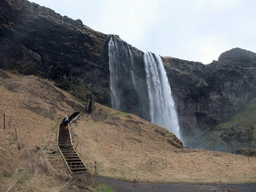 Miaomiao on the northern staircase at the Seljalandsfoss waterfall