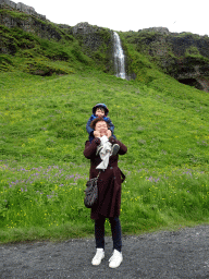 Miaomiao and Max in front of a smaller waterfall at the north side of the Seljalandsfoss waterfall