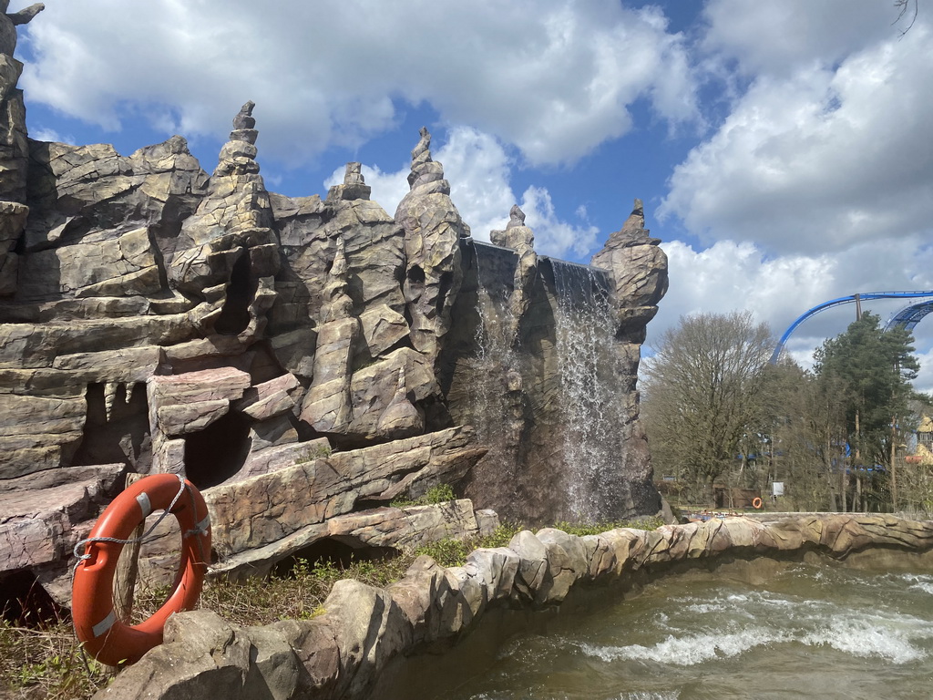 Waterfall at the Djengu River attraction at the Magische Vallei section and the Fenix attraction at the Avalon section at the Toverland theme park, viewed from our boat