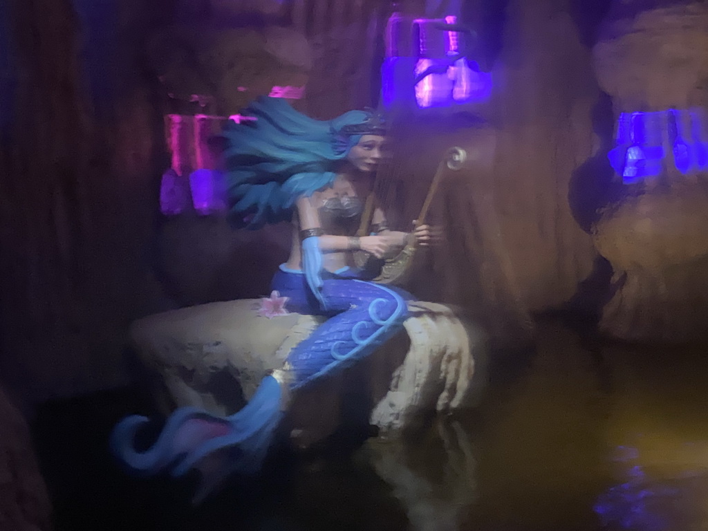 Mermaid statue at the cave at the Merlin`s Quest attraction at the Avalon section at the Toverland theme park