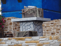 Table, chests and bottel on the stage at the Port Laguna section at the Toverland theme park, just before the Aqua Bellatores show
