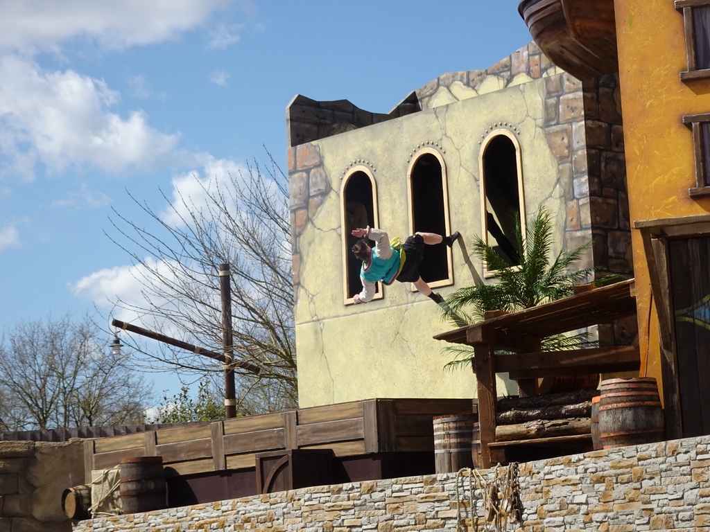 Actor on a trampoline on the stage at the Port Laguna section at the Toverland theme park, during the Aqua Bellatores show