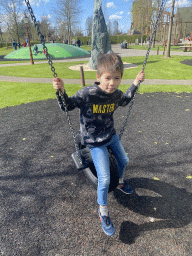 Max on a swing at the playground at the Wunderwald section at the Toverland theme park