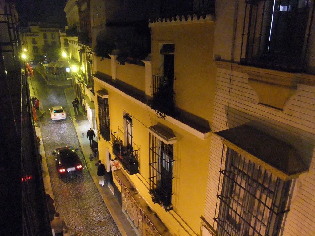 View on the Calle San José street and the Calle Santa Maria la Blanca street from the balcony of our room in Hotel Fernando III, by night