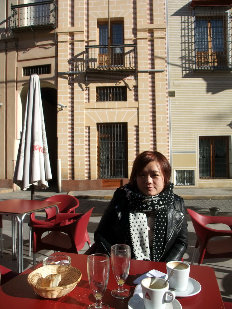 Miaomiao at the terrace of the restaurant `Carmela` in the Calle Santa Maria la Blanca street