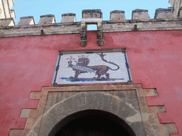 Painting of a lion at the Lion`s Gate of the Alcázar of Seville