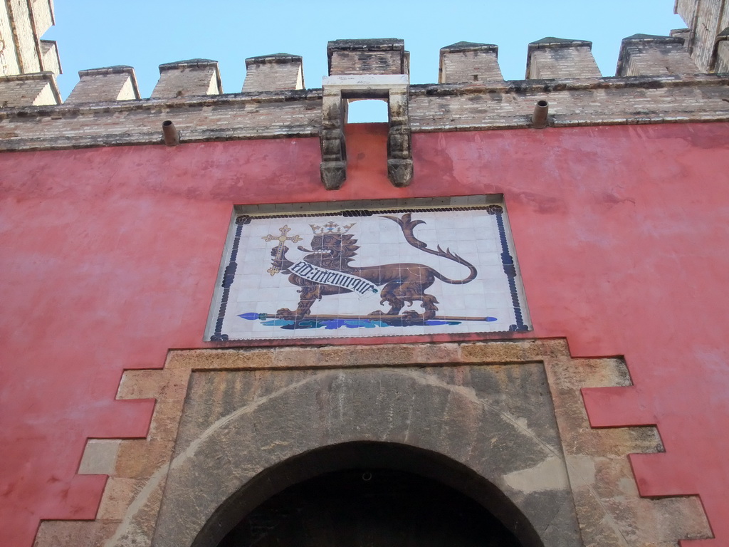 Painting of a lion at the Lion`s Gate of the Alcázar of Seville
