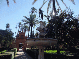 Fountain and gate at the Jardín de la Danza at the Gardens of the Alcázar of Seville