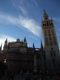 The east side of the Seville Cathedral with the Giralda tower at the Plaza Virgen de los Reyes square
