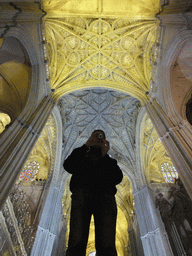 Tim with a mirror and the reflection of the ceiling of the Seville Cathedral