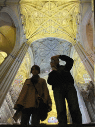 Tim and Miaomiao with a mirror and the reflection of the ceiling of the Seville Cathedral