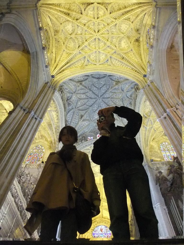 Tim and Miaomiao with a mirror and the reflection of the ceiling of the Seville Cathedral