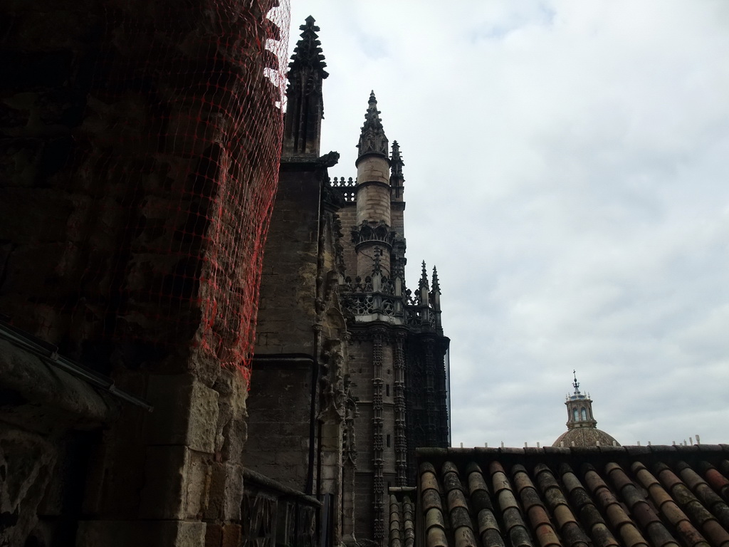 The roof of the Seville Cathedral and the dome of the Iglesia del Sagrario church, viewed from the ramp in the Giralda tower