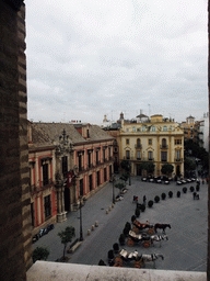 The Palacio Arzobispal, the Restaurante El Giraldillo and horses and carriages at the Plaza Virgen de los Reyes square, viewed from the ramp in the Giralda tower