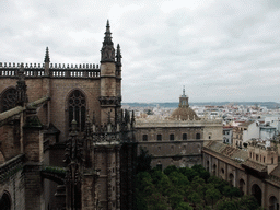 The roof of the Seville Cathedral, the Patio de los Naranjos courtyard and the dome of the Iglesia del Sagrario church, viewed from the ramp in the Giralda tower