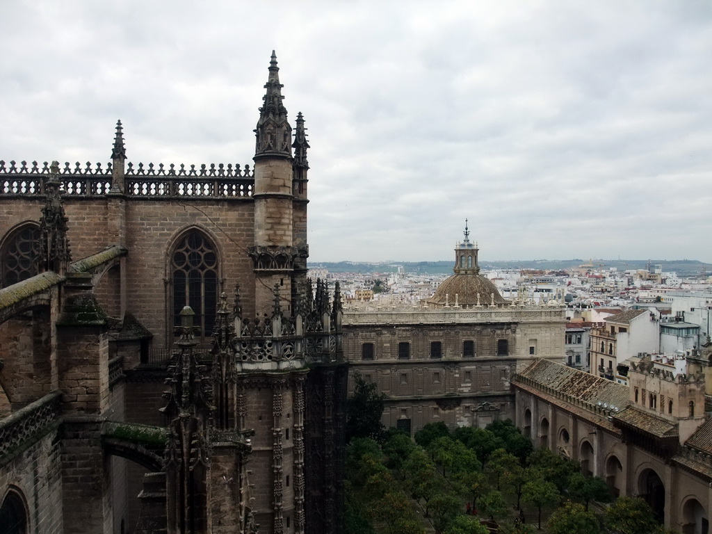 The roof of the Seville Cathedral, the Patio de los Naranjos courtyard and the dome of the Iglesia del Sagrario church, viewed from the ramp in the Giralda tower