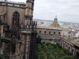The roof of the Seville Cathedral, the Patio de los Naranjos courtyard and the dome of the Iglesia del Sagrario church, viewed from the ramp in the Giralda tower