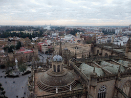 The roof of the Seville Cathedral, the Monument of the Immaculate Conception at the Plaza del Triunfo square, the Alcázar of Seville and the Archivo General de Indias, viewed from the top of the Giralda tower