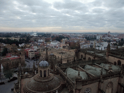 The roof of the Seville Cathedral, the Monument of the Immaculate Conception at the Plaza del Triunfo square, the Alcázar of Seville and the Archivo General de Indias, viewed from the top of the Giralda tower