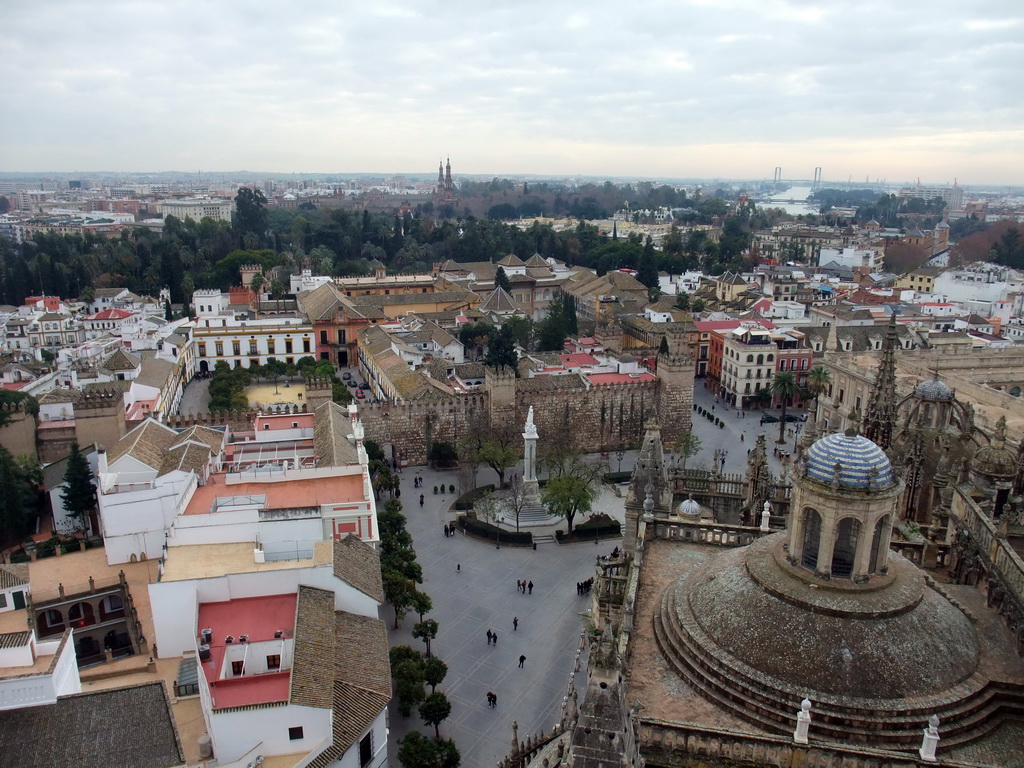 The roof of the Seville Cathedral, the Monument of the Immaculate Conception at the Plaza del Triunfo square, the Alcázar of Seville, the Patio de las Banderas courtyard and the Archivo General de Indias, viewed from the top of the Giralda tower