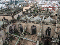 The roof of the Seville Cathedral and the Plaza de Toros de la Real Maestranza de Caballería de Sevilla bullring, viewed from the top of the Giralda tower