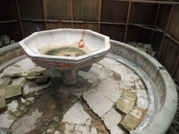 Fountain under renovation at the center of the Patio de los Naranjos courtyard